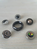Pavo Real interchangeable ring, black steel + 6 tops, VG condition