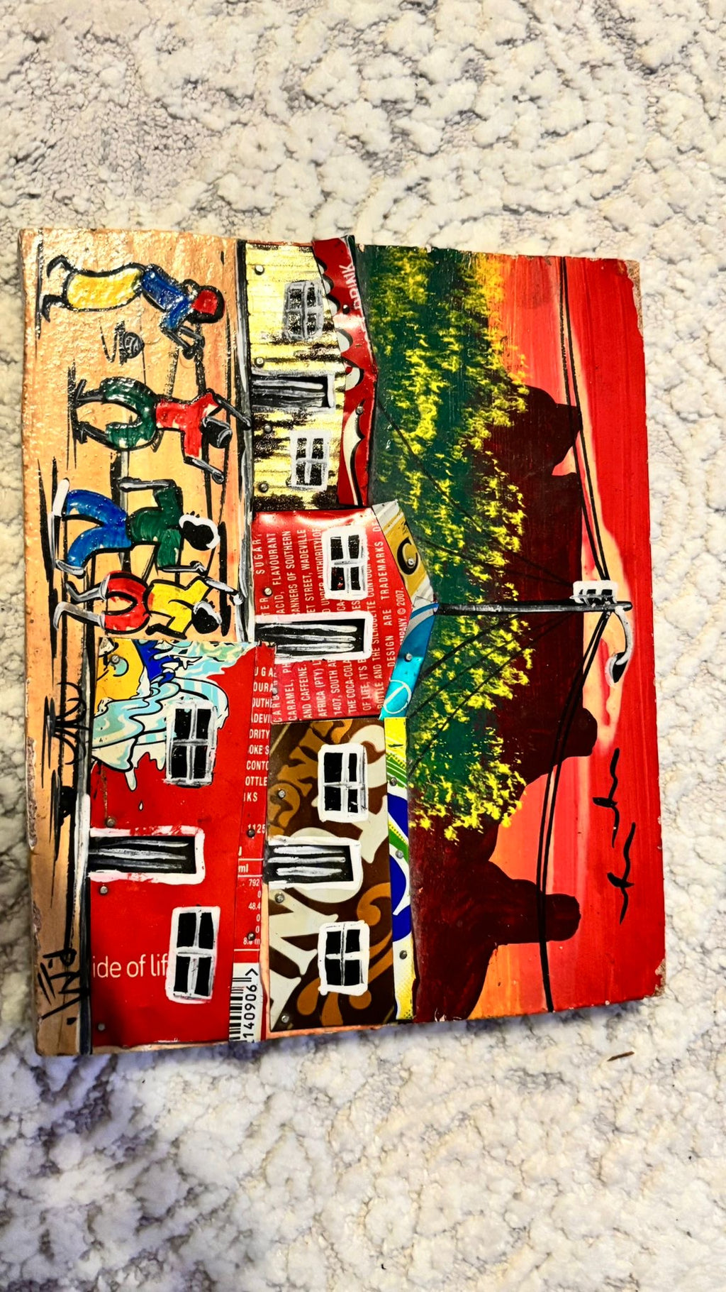 Haitian recycled-tin folk art painting, signed “RAM”, multicolor, 23×18 cm, good