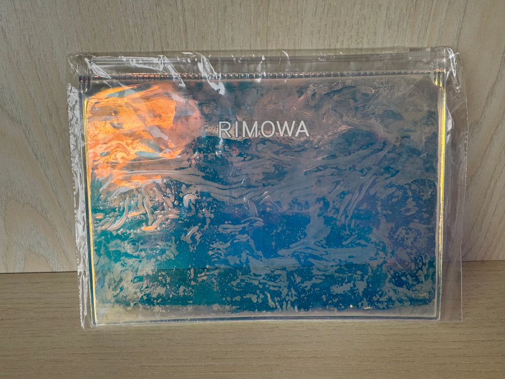 RIMOWA “Magma” Travel Pouch – Polycarbonate, Orange/Purple, Medium, Like New