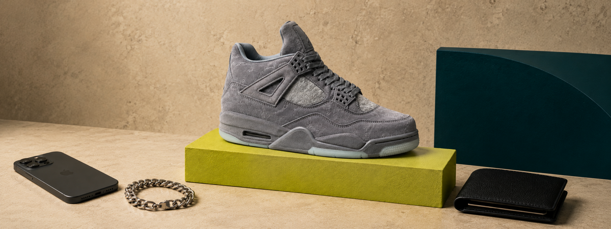 Eternal Things intro editorial still life with grey sneaker, iPhone, bracelet and wallet